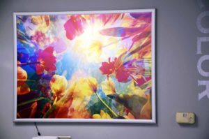 Image of a backlit print with a snap frame, installed in an office in Morrisville, NC.