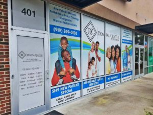 Image of perforated window graphics, installed on a store front in Zebulon, NC.