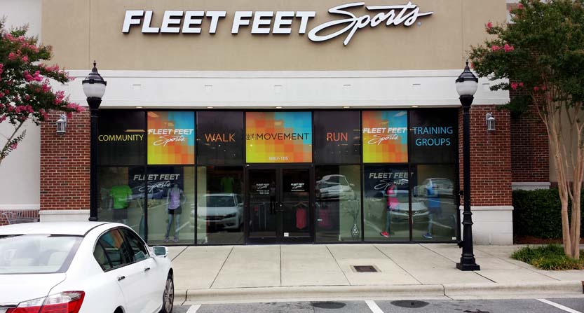 Image of perforated window graphics, installed on a store front in Durham, NC.