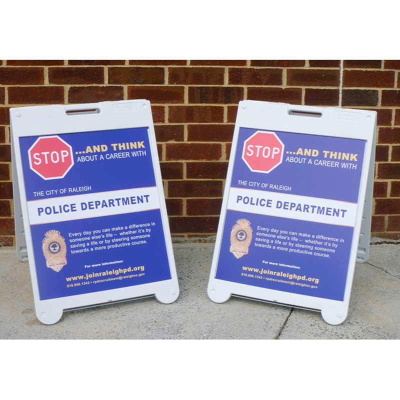 white plastic a-frame sign for city of raleigh police department