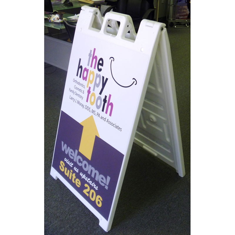 white plastic a-frame sign for the happy tooth family dentistry Cary