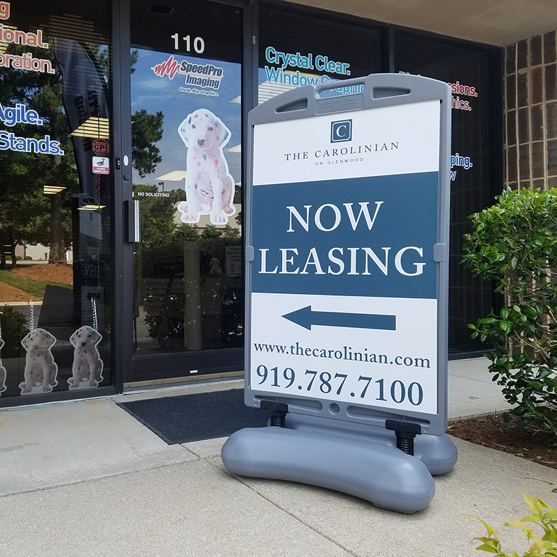 The carolinian now leasing outdoor wind sign Raleigh