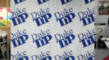 step and repeat photo backdrop with silver stand for Duke TIP event, Durham