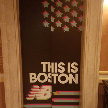 Boston centered New Balance elevator signage in window