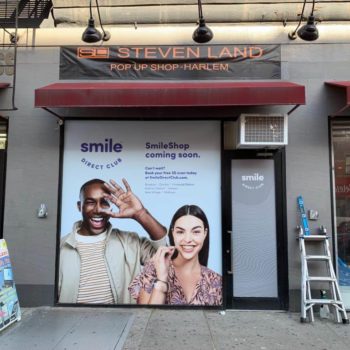 Smile Direct Club Two Models in Harlem window covering graphic