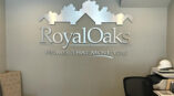Royal Oaks - metal cut out displayed on wall