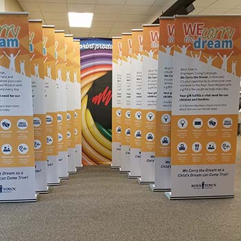 We Carry the Dream banner stands