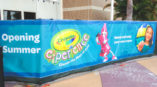 Construction fence banner at Crayola store at mall