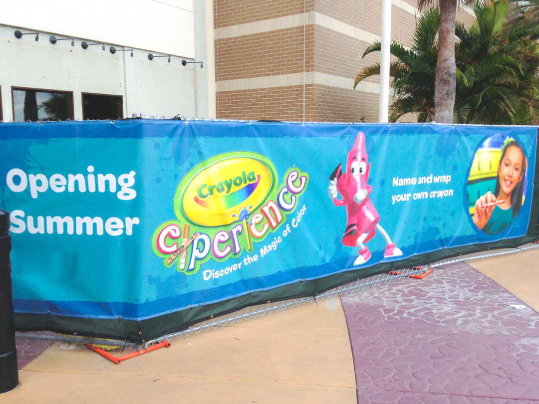 Construction fence banner at Crayola store at mall