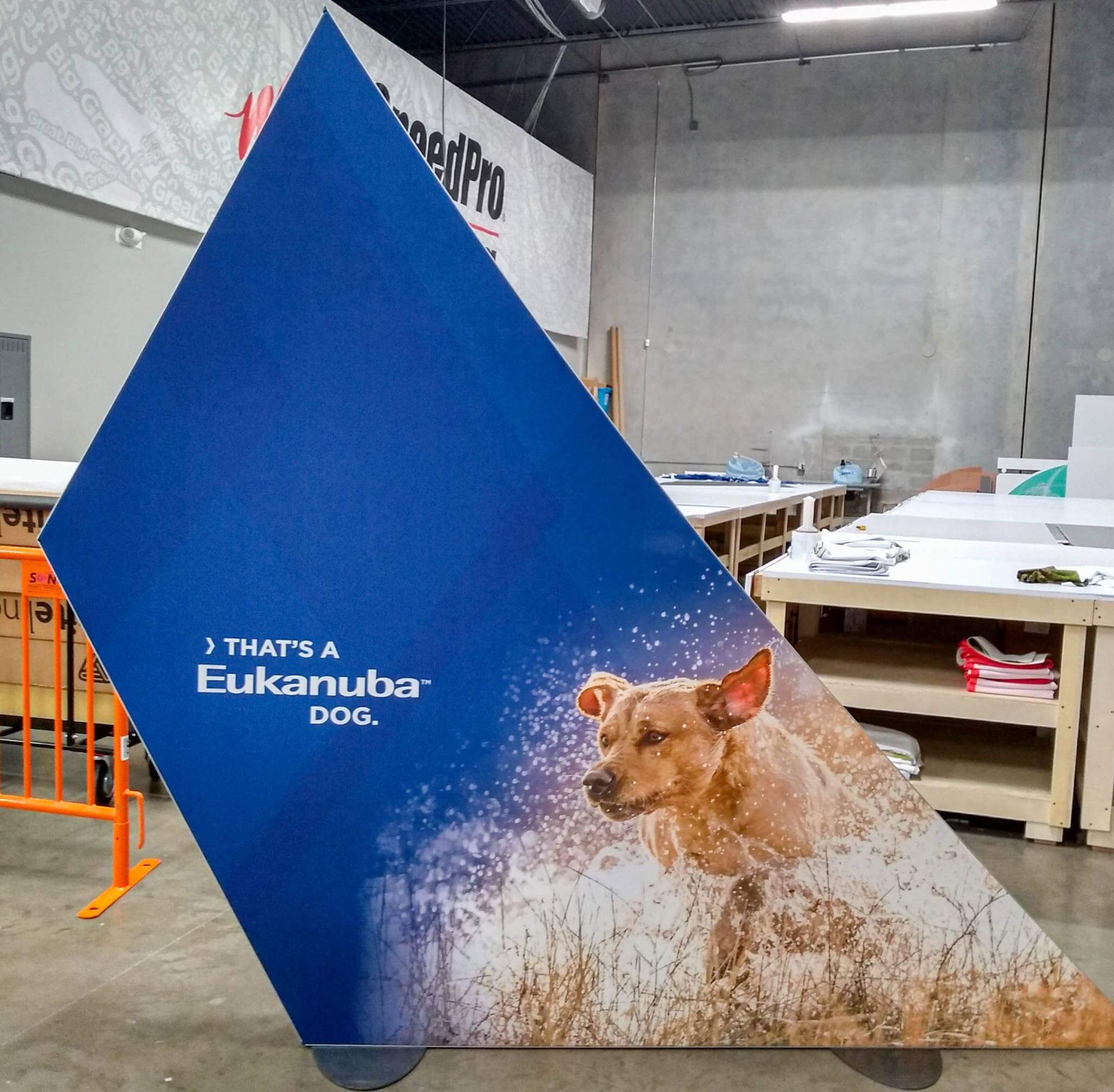 free-standing display stands on a concrete floor