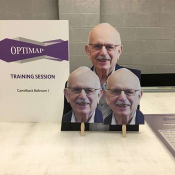 Optimap Training Session sign with cutouts of speakers head
