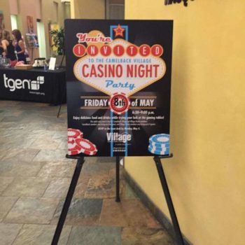 Event graphic sign on a stand promoting a casino night