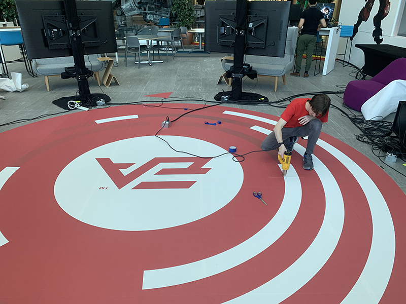 Man working on a street decal for EA Sports brand