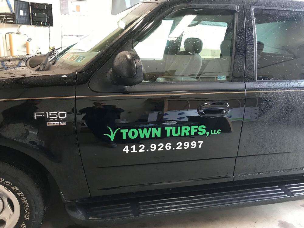 Town Turfs LLC logo and phone number vehicle decals
