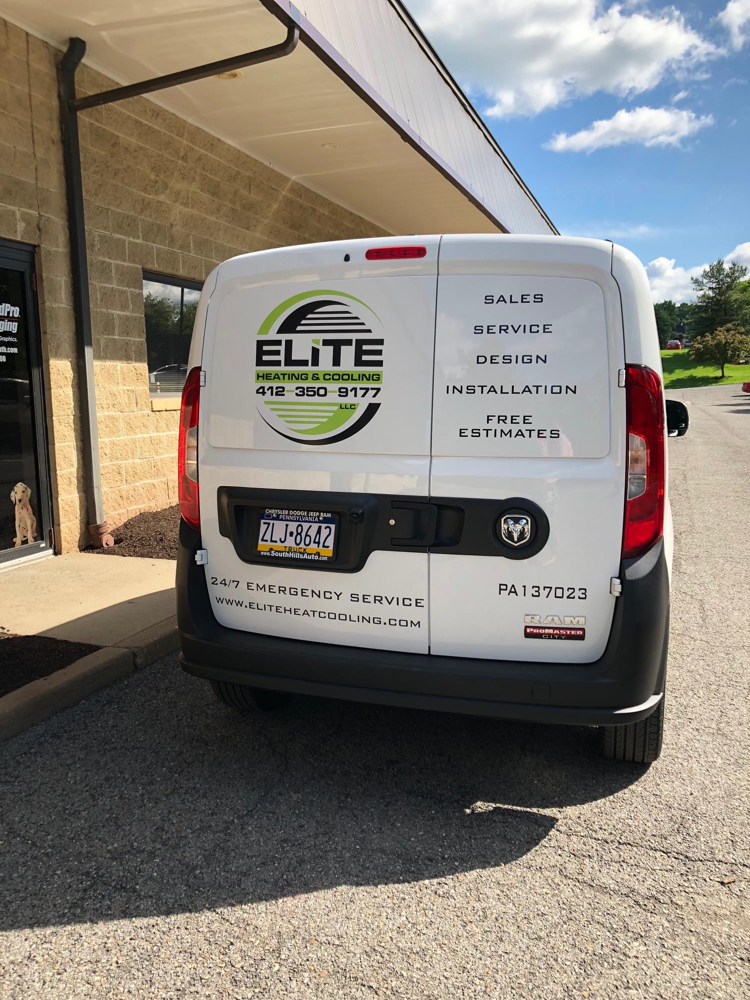 Elite Heating and Cooling decals on back of vehicle