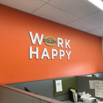 Wall lettering with phrase Work Happy