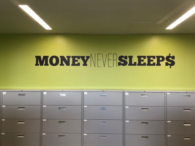 Wall decal with phrase Money Never Sleeps