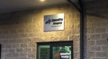 SpeedPro entrance outdoor wall graphic