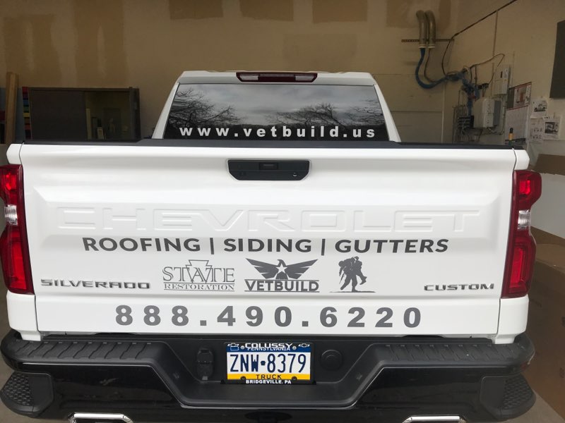 Vetbuild Roofing back of truck wrap