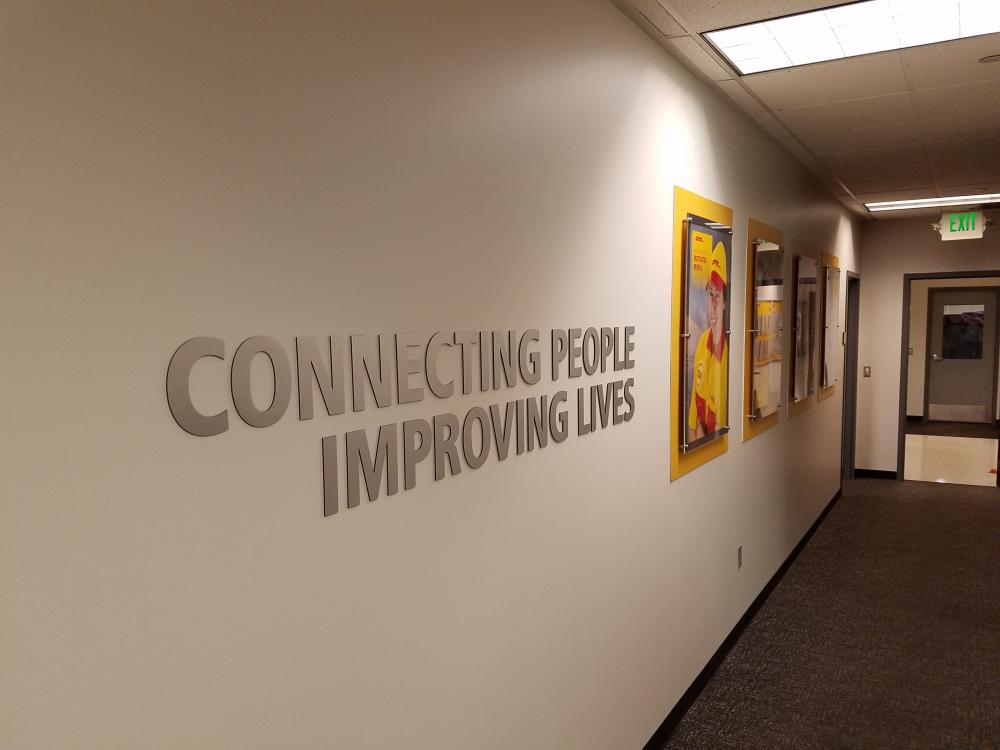 Connecting People Improving Lives office signage