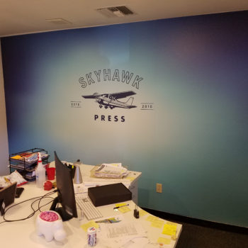 Skyhawk Press wall mural in office