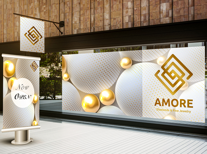 White and gold signage for Amore Diamonds & Fine Jewelry with golden orbs.