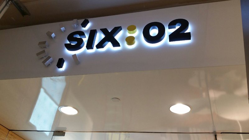 Six:02 storefront signage