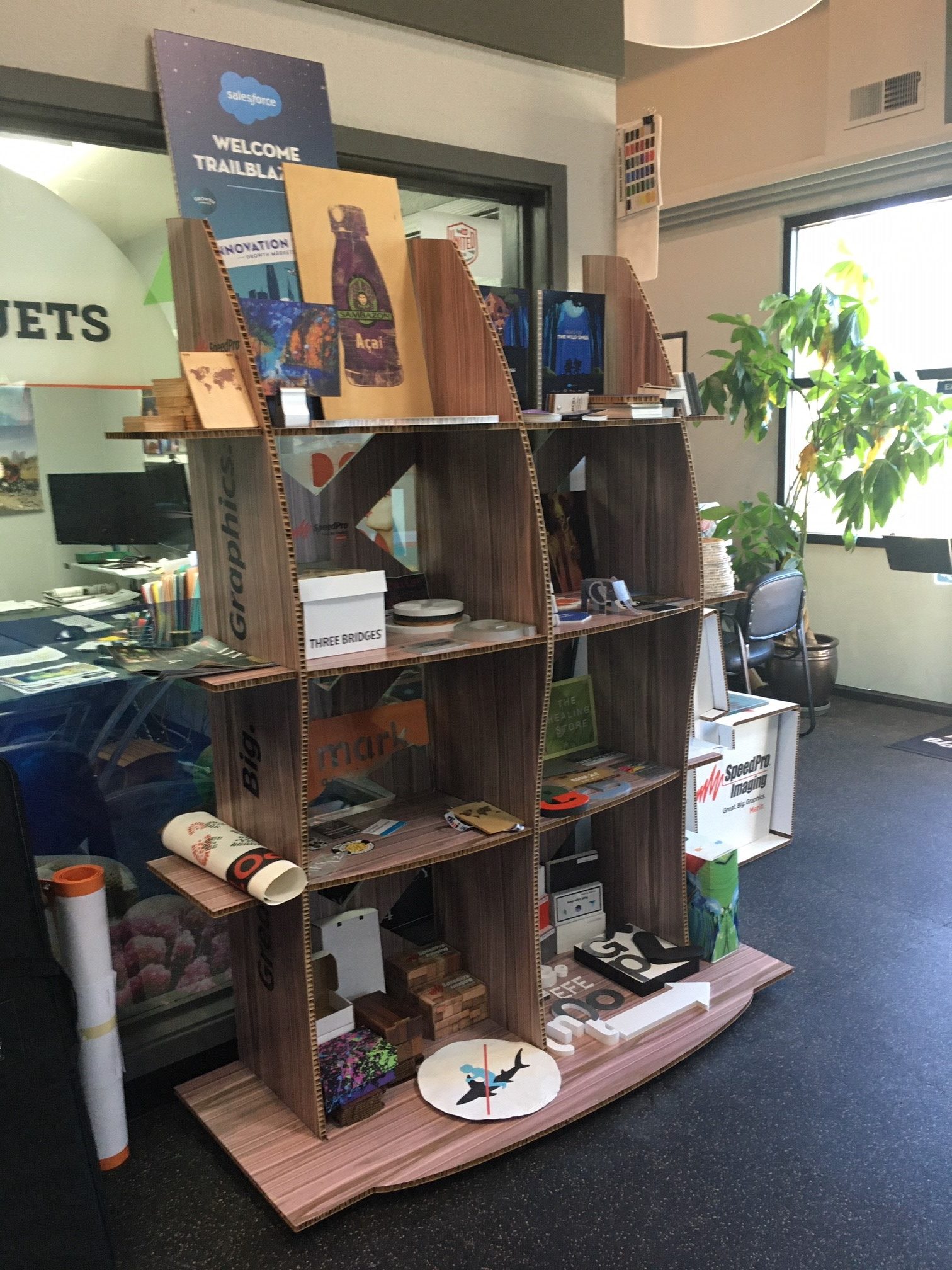 Wooden shelving display showcasing various products, featuring sturdy wood shelf design.