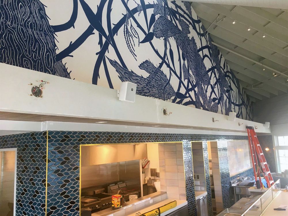 Interior design detail with patterned wall and decorative ceiling view