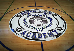 Graphic in the middle of a basketball court of Aspen View Academy.