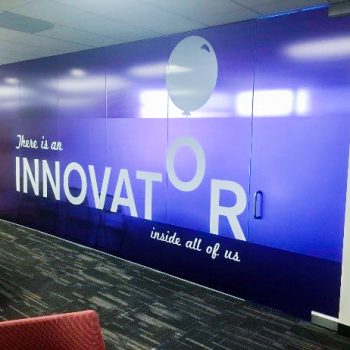 Glass etching on company windows with motivational quote