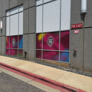 Colorful decorative window film applied to lower glass panels on a commercial building in Raleigh,NC