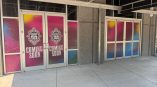 Colorful vinyl window film applied to glass doors and windows in Raleigh, NC.