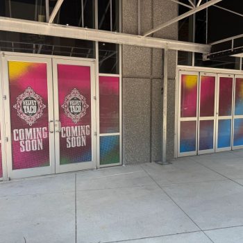 Colorful vinyl window film applied to glass doors and windows in Raleigh, NC.