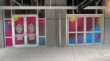 Colorful window film applied to glass doors and panels on a commercial building in Raleigh, NC.