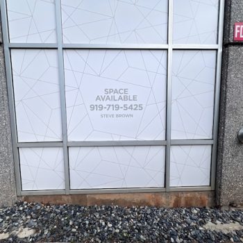 Frosted geometric window film applied on commercial glass panels in Raleigh, NC.