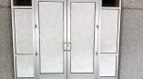 Frosted geometric window film applied to glass double doors and side panels in Raleigh, NC.