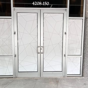 Frosted geometric window film applied to glass double doors and side panels in Raleigh, NC.