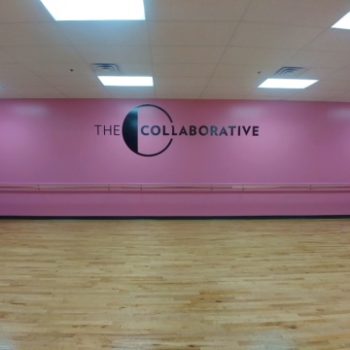 pink wall with decal for The Collaborative
