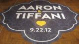 Wedding floor graphic with bride and groom names and date