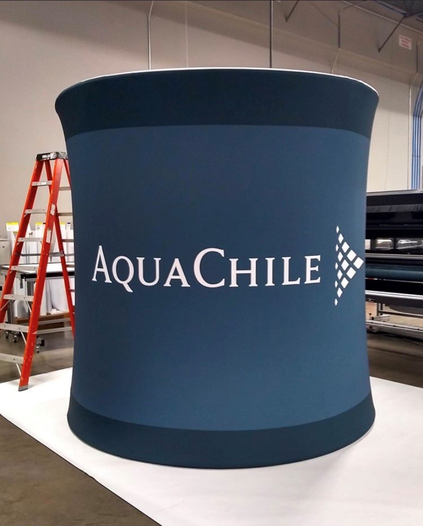 Blue and white advertising banner with logo on display