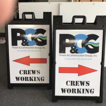 Crews working directional signage with arrows for p&cg