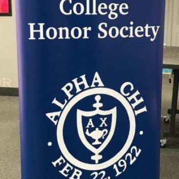 Blue standing banner for Alpha Chi National College Honor Society