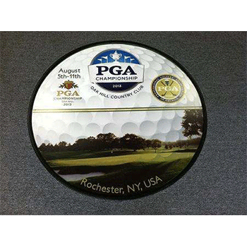 Floor graphic of golf ball with golf course image inside for PGA championship