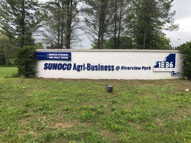Blue outdoor signage for sunoco agri-business at riverview park