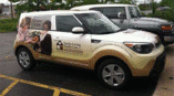 Vehicle wrap for tender loving family care on white car with image of elder and caretaker