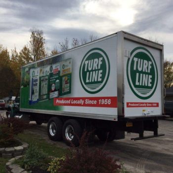 Turf line fleet wrap with product images and red box with phrase produced locally since 1956