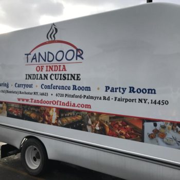 Tandoor of india vehicle wrap with locations and website name and line of photos of food