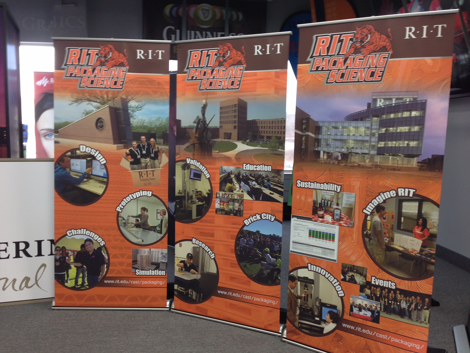 Three RIT Packaging banner stands with services