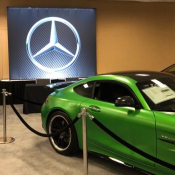 Mercedez Benz logo tradeshow display with green car